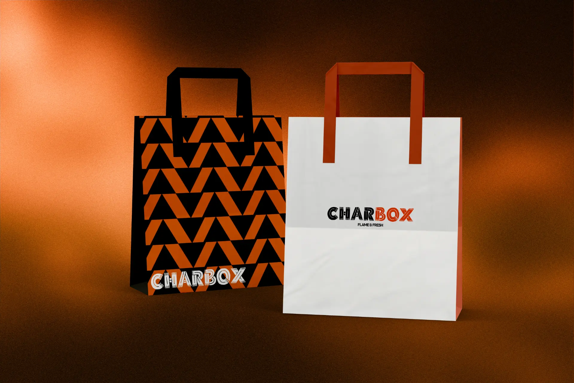 Charbox branded takeaway bags in black, orange and white